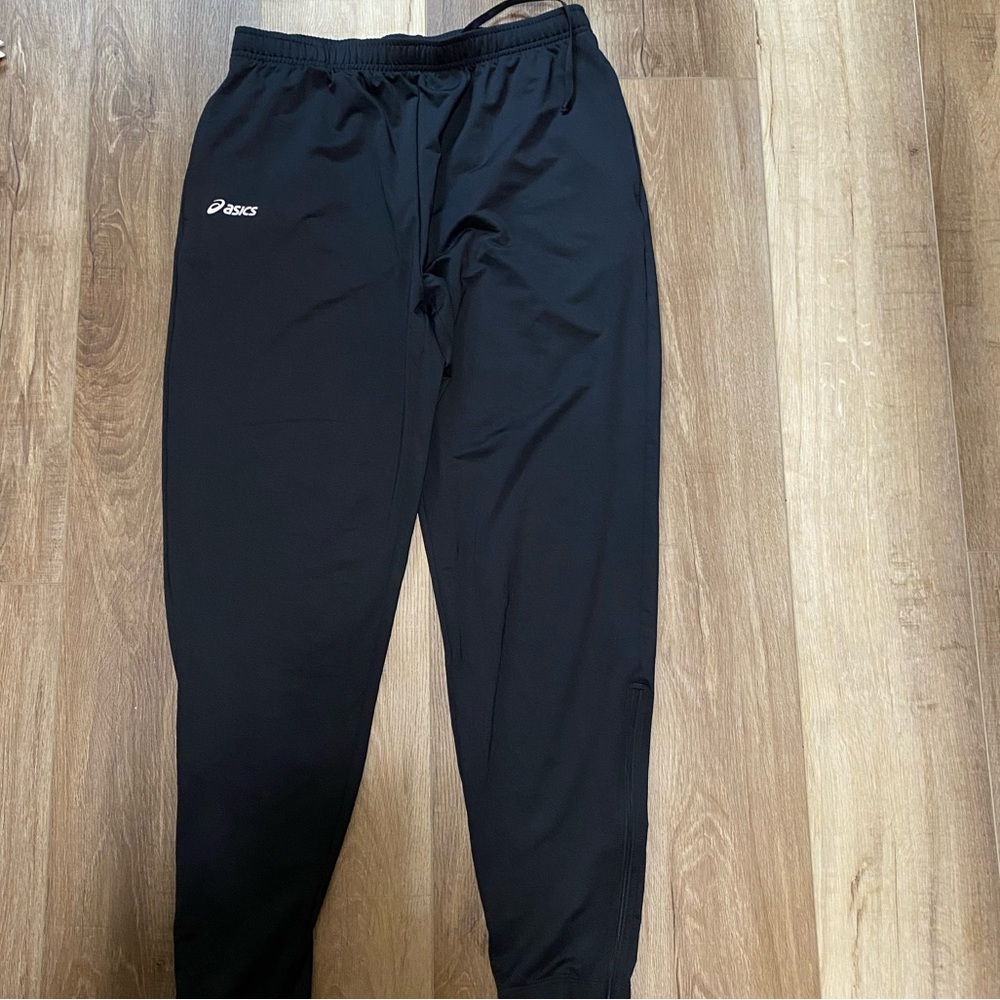 ASICS jogger pants with zipper on the bottom of the legs for extra room